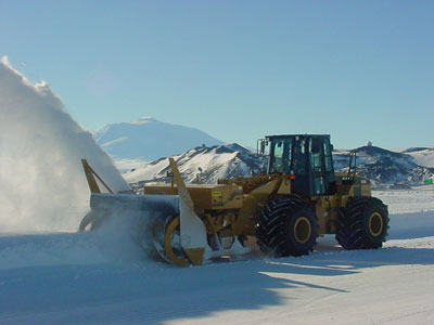 Hydrostatic loader mounted snow blower