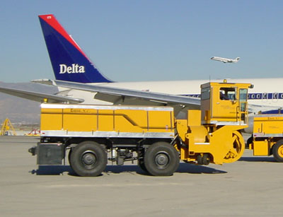 Single engine, cab forward, rear discharge